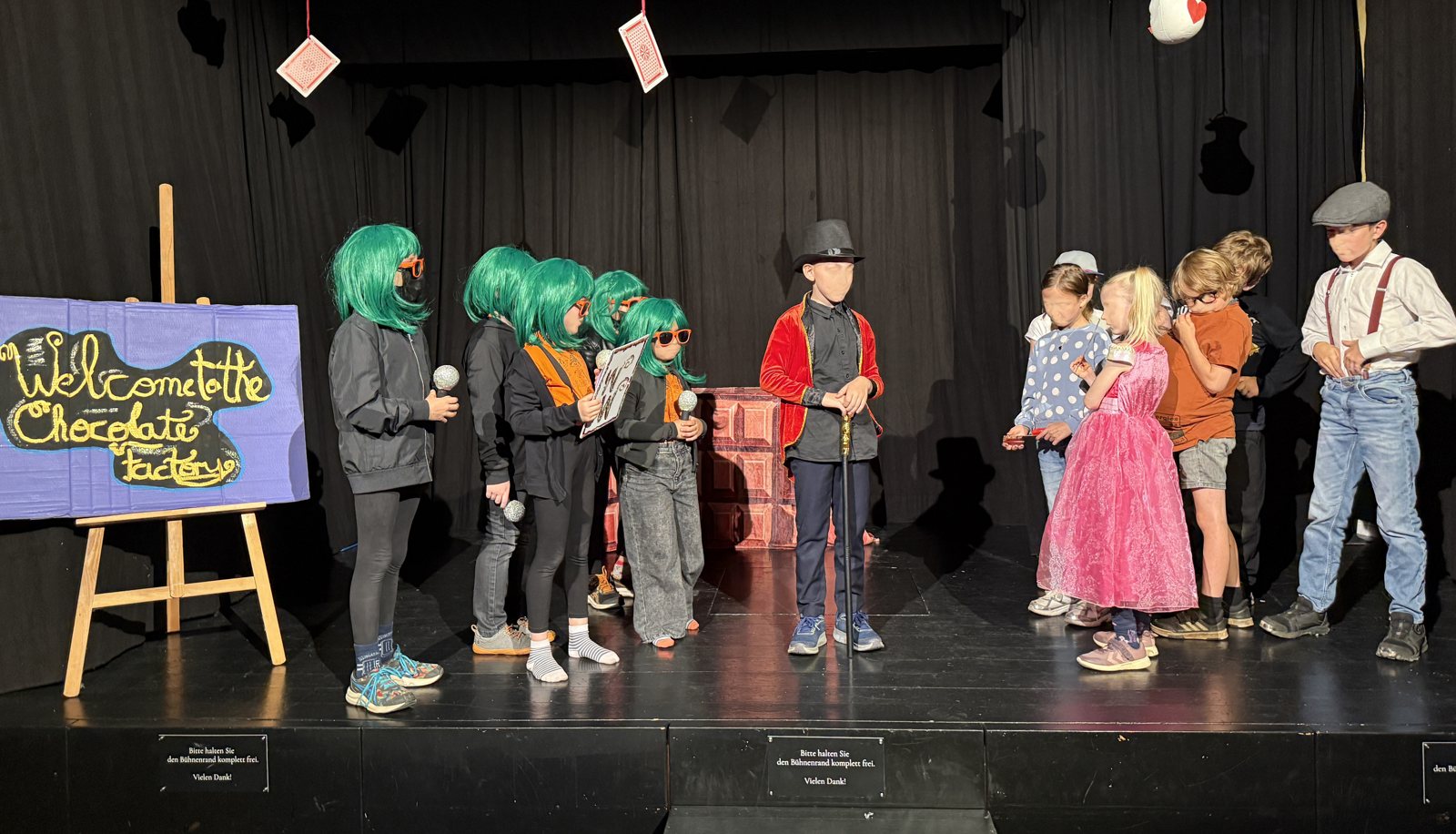Children performing Charlie and the Chocolate Factory on stage