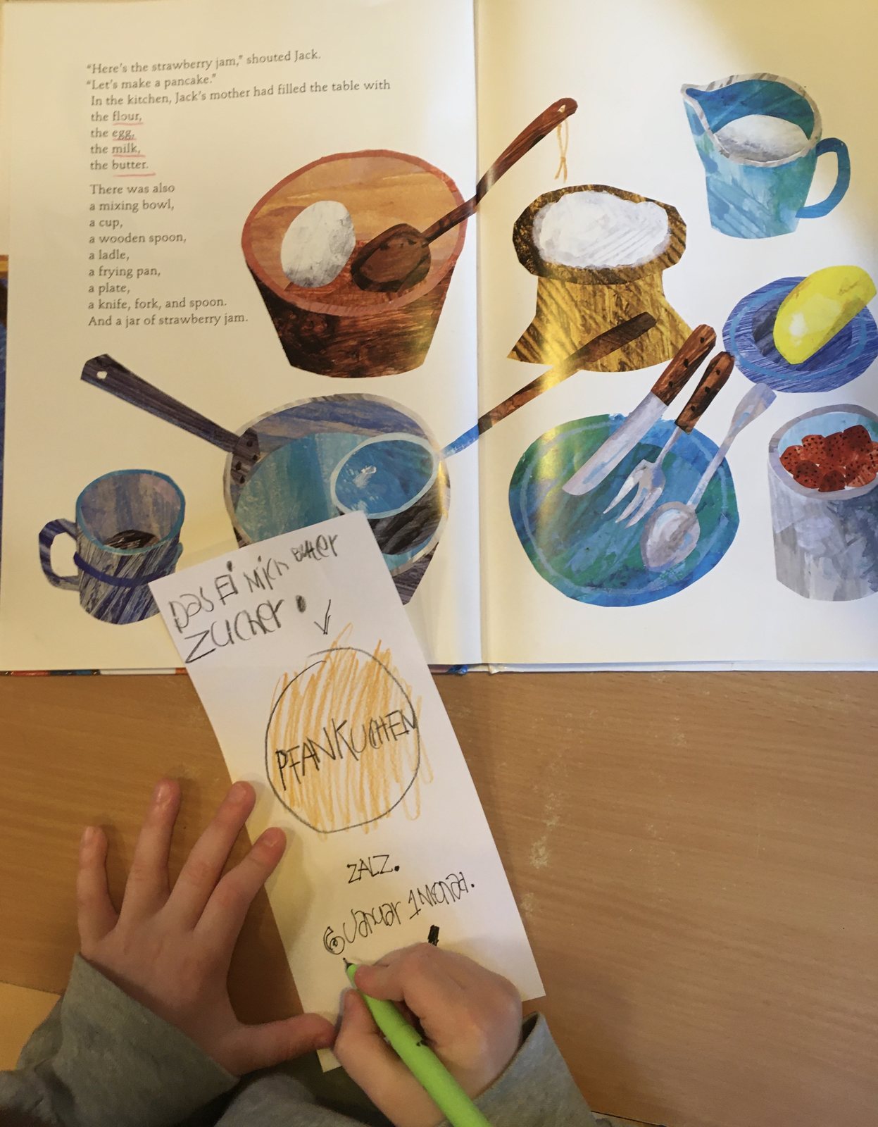 A child writing a pancake recipe based on an English picture book
