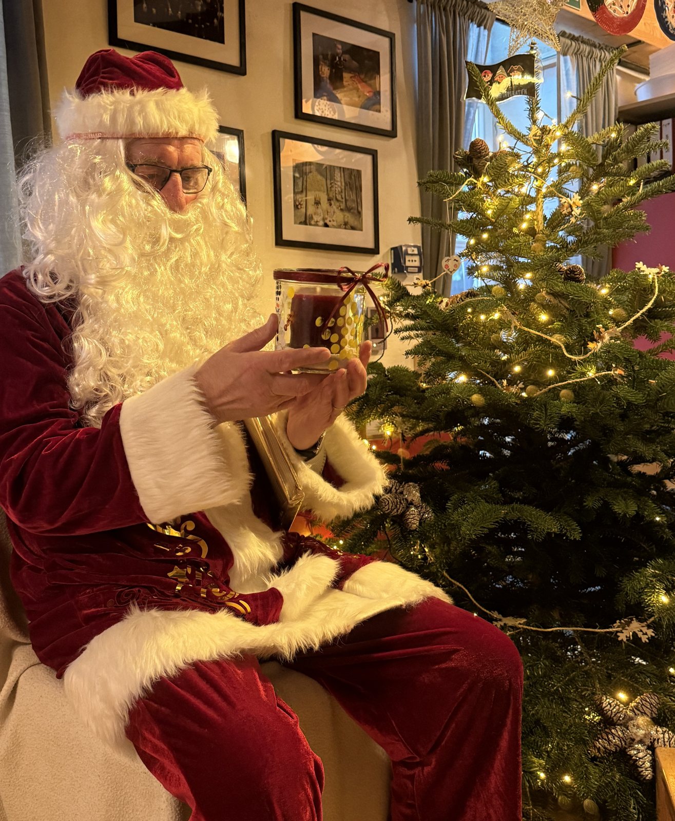 Santa Claus next to the Christmas tree